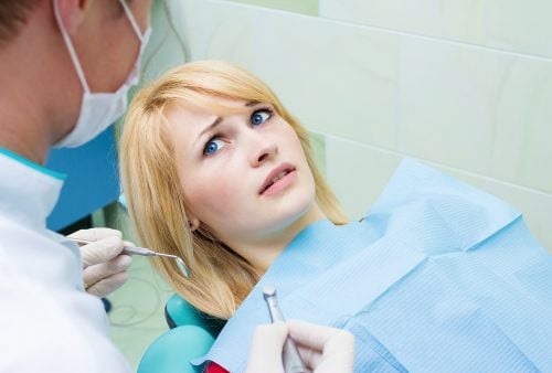 anxious woman in dental chair